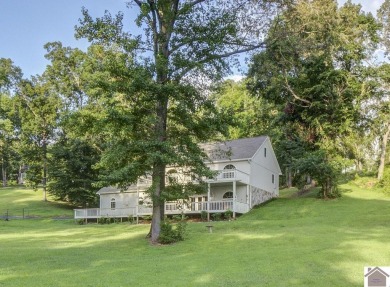 Private and spacious, situated on almost an acre, this Lake - Lake Home For Sale in Cadiz, Kentucky