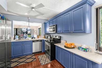 Enjoy serene golf course living in this spectacular second-floor - photo 14