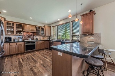 Tucked into the trees in one of Sandpoint's most sought-after - photo 12