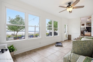 This charming waterfront cottage is tucked along a quiet stretch - photo 22