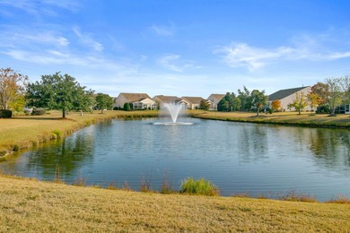 Pond living in this spacious, turn-key home in Del Webb Cane Bay