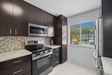 Experience waterfront living in this beautifully updated - photo 5