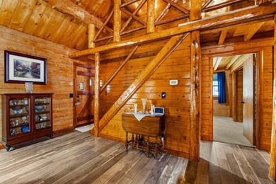 Rustic charm meets modern comfort in this beautiful log home - photo 3