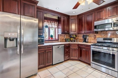 Set on a level, fully fenced property in East Islip, this 3 - photo 11