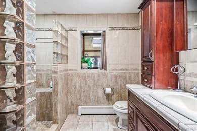 Set on a level, fully fenced property in East Islip, this 3 - photo 19