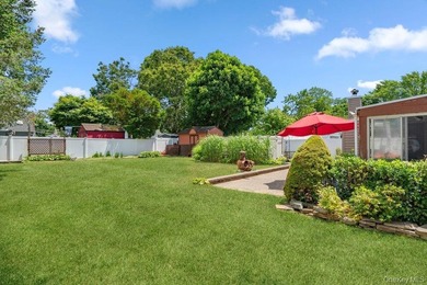Set on a level, fully fenced property in East Islip, this 3 - photo 27