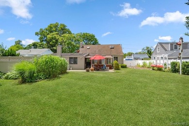Set on a level, fully fenced property in East Islip, this 3 - photo 29