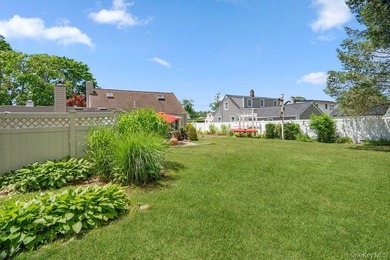 Set on a level, fully fenced property in East Islip, this 3 - photo 30