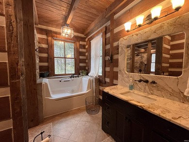 This one-of-a-kind custom log home, built in 2015, blends luxury - photo 19