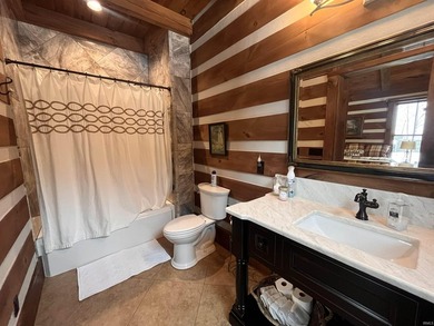 This one-of-a-kind custom log home, built in 2015, blends luxury - photo 24