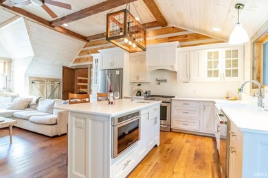This one-of-a-kind custom log home, built in 2015, blends luxury - photo 27