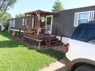 Welcome home! This well-maintained 1990 manufactured home offers - photo 3