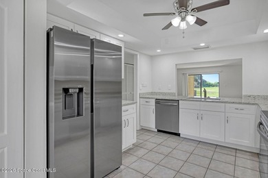 RIVERFRONT LIVING AT ITS FINEST! This stunning ground floor - photo 15