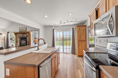 Tucked off the road on 4 peaceful acres, this 2005 custom ranch - photo 11