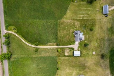 Tucked off the road on 4 peaceful acres, this 2005 custom ranch - photo 44
