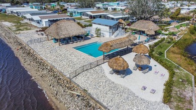 Nestled within the serene 55+ community of Harbor View on the - photo 12