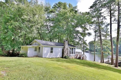 Wake up to breathtaking long-range views of Lake Harding from - photo 1