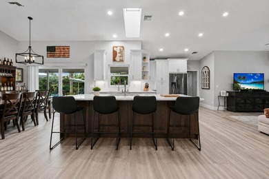 Beautifully updated 4BR/2BA pool home located in the highly - photo 6