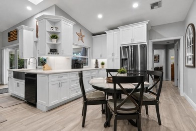 Beautifully updated 4BR/2BA pool home located in the highly - photo 7