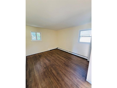 High Ranch With Updated Kitchen And Large Living Room. Hardwood - photo 12