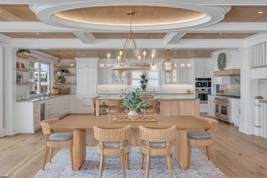 Welcome to 55 Walnut Road, a stunning bayfront masterpiece. This