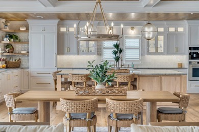 Welcome to 55 Walnut Road, a stunning bayfront masterpiece. This