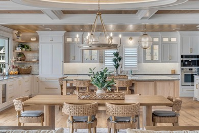 Welcome to 55 Walnut Road, a stunning bayfront masterpiece. This