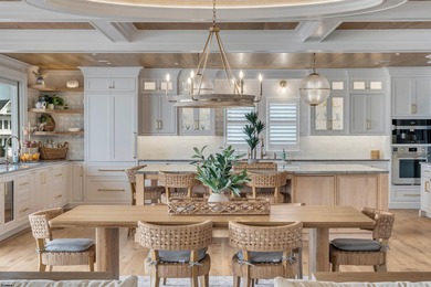 Welcome to 55 Walnut Road, a stunning bayfront masterpiece. This