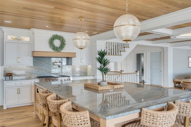 Welcome to 55 Walnut Road, a stunning bayfront masterpiece. This