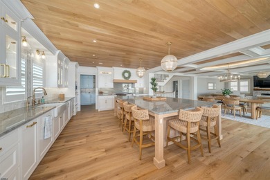 Welcome to 55 Walnut Road, a stunning bayfront masterpiece. This