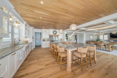 Welcome to 55 Walnut Road, a stunning bayfront masterpiece. This