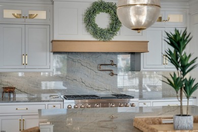 Welcome to 55 Walnut Road, a stunning bayfront masterpiece. This