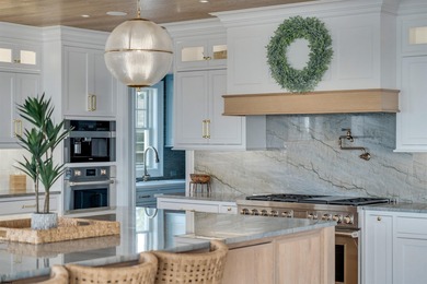 Welcome to 55 Walnut Road, a stunning bayfront masterpiece. This