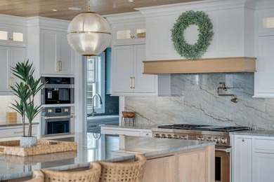 Welcome to 55 Walnut Road, a stunning bayfront masterpiece. This