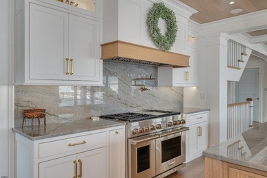 Welcome to 55 Walnut Road, a stunning bayfront masterpiece. This