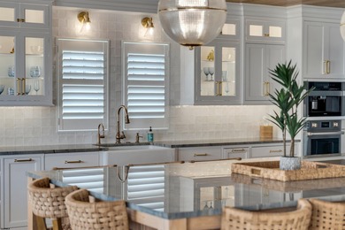 Welcome to 55 Walnut Road, a stunning bayfront masterpiece. This