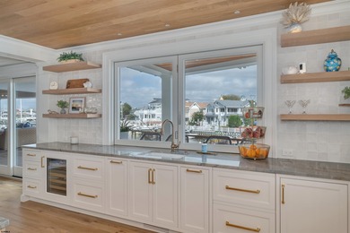 Welcome to 55 Walnut Road, a stunning bayfront masterpiece. This