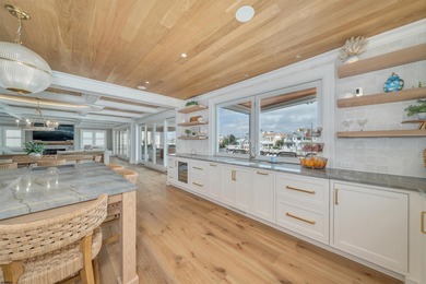 Welcome to 55 Walnut Road, a stunning bayfront masterpiece. This