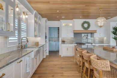 Welcome to 55 Walnut Road, a stunning bayfront masterpiece. This