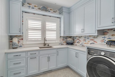 Welcome to 55 Walnut Road, a stunning bayfront masterpiece. This