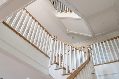 Welcome to 55 Walnut Road, a stunning bayfront masterpiece. This