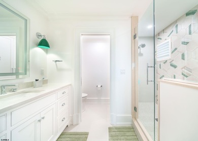 Welcome to 55 Walnut Road, a stunning bayfront masterpiece. This