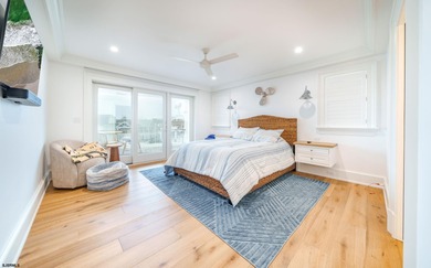 Welcome to 55 Walnut Road, a stunning bayfront masterpiece. This