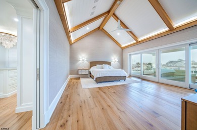 Welcome to 55 Walnut Road, a stunning bayfront masterpiece. This