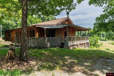 Welcome home to your Ozark oasis on the beautiful George's