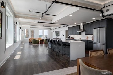 Step into refined downtown living with Unit 600 at The Alston, a