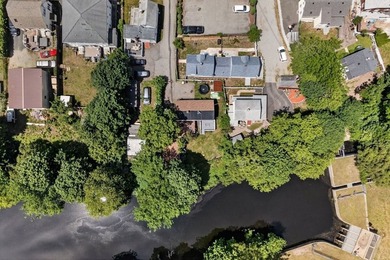 Nestled in a picturesque waterfront setting, this single family - photo 2