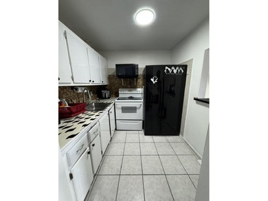 Welcome to easy living in Century Village! Move-in ready - photo 7