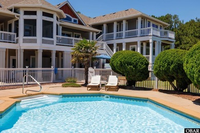 Tucked inside the gates of The Currituck Club, this six-bedroom - photo 2