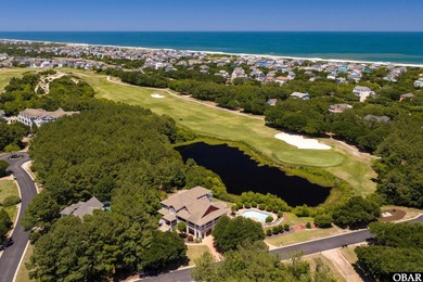 Tucked inside the gates of The Currituck Club, this six-bedroom - photo 3